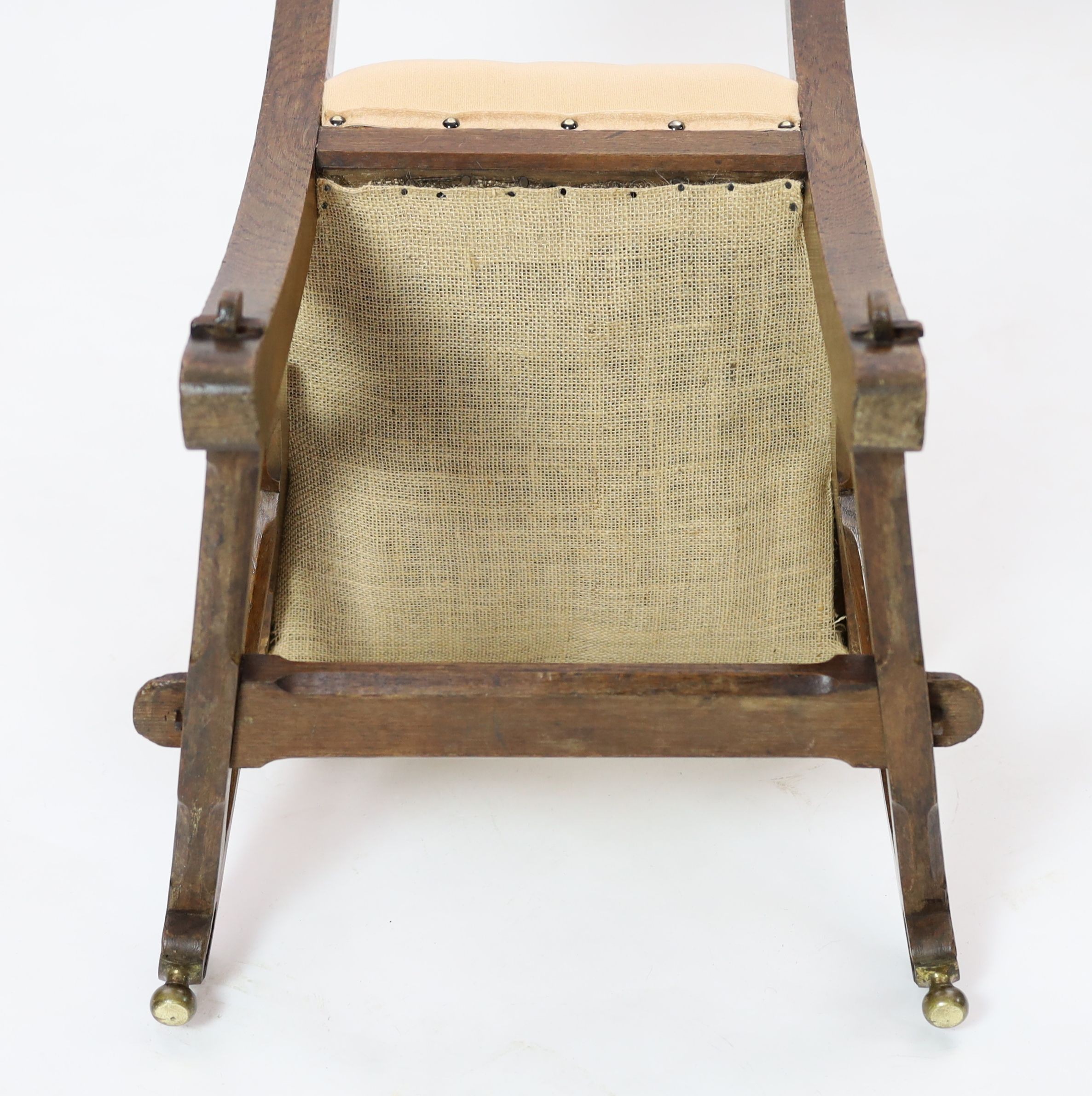 A Victorian reformed gothic oak dining chair designed by Edward Welby Pugin, c.1864, W. 50cm. D. 48cm. H. 84cm.